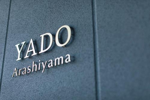 a close up of a yoda insignia on a car door at Yado Arashiyama in Kyoto