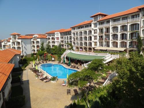 a view of a hotel with a swimming pool at Triumph Holiday Village in Sveti Vlas