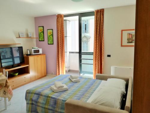 Postel nebo postele na pokoji v ubytování Caravaggio Apartments