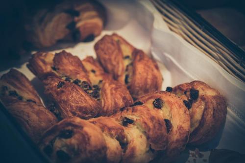 a pile of pastries sitting on top of a table at Hotel Mon Repos in Geneva