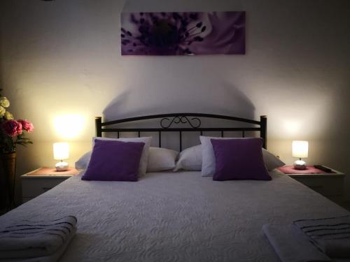 Łóżko lub łóżka w pokoju w obiekcie Rooms Sibila