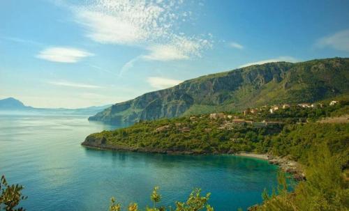 a view of a body of water with a mountain at Hotel Club San Diego in Maratea