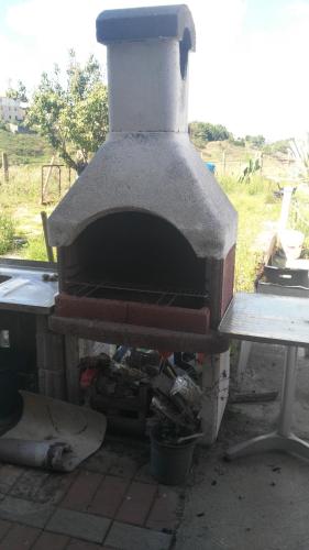 a pizza oven sitting on top of a table at Sa Mendula in Bonorva