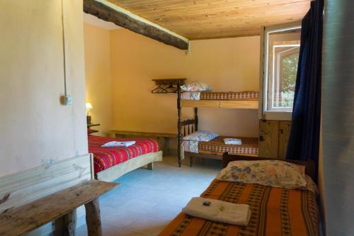En eller flere senger på et rom på Casa Calchaqui