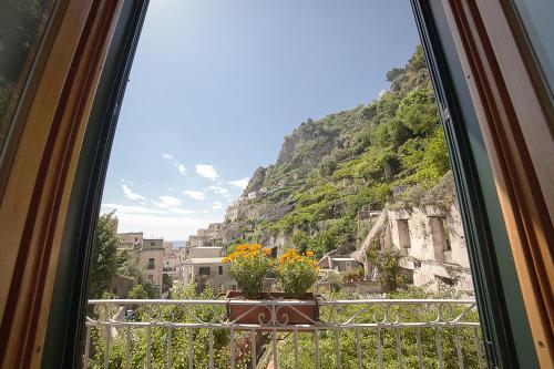 a window with a view of a mountain at Hotel L'Argine Fiorito in Atrani