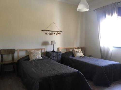 Postel nebo postele na pokoji v ubytování Casa Caminhos