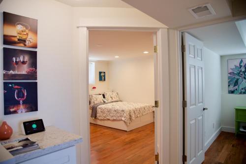 a bedroom with a bed and a door leading into a room at Scenic Lake View Home in Tacoma