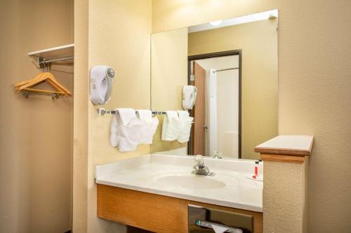 a bathroom with a sink and a mirror at Super 8 by Wyndham Kremmling in Kremmling