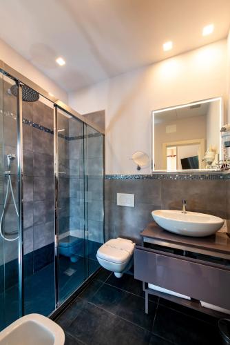 a bathroom with a toilet and a sink and a shower at Hotel Sant'Andrea in Santa Margherita Ligure