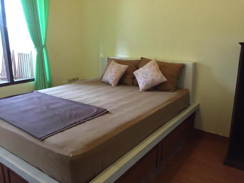 Кровать или кровати в номере Melbao Homestay