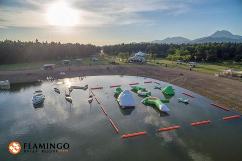a bunch of boats in a body of water at FLAMINGOS Villa Happy 3 phòng ngủ- view Hồ- bể bơi riêng in Ngọc Quang