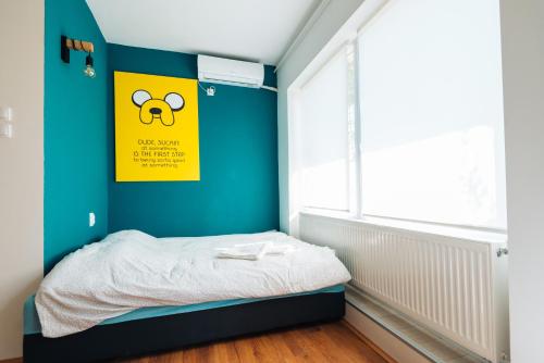 A bed or beds in a room at Smile apARTment