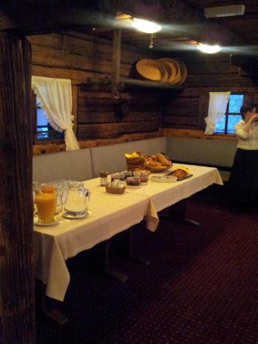 a table with food on it in a restaurant at Hotel Restaurant Kulm in Triesenberg
