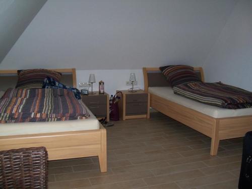 מיטה או מיטות בחדר ב-Zum-Luetten-Leuchtturm