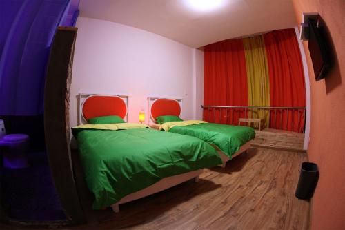 Cama ou camas em um quarto em Dalan Youth Hostel