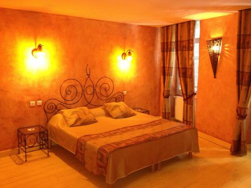 Katil atau katil-katil dalam bilik di Hotel L'Astrolabe
