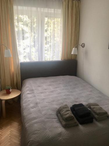 Ένα ή περισσότερα κρεβάτια σε δωμάτιο στο Apartament Telimena