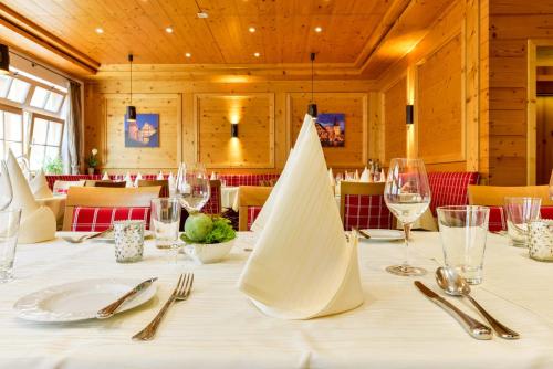 a dining room with a table with a napkin on it at Hotel Restaurant Sonne in Gengenbach