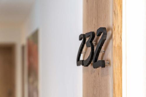 a black house number on a wooden door at Hotel Restaurant Sonne in Gengenbach