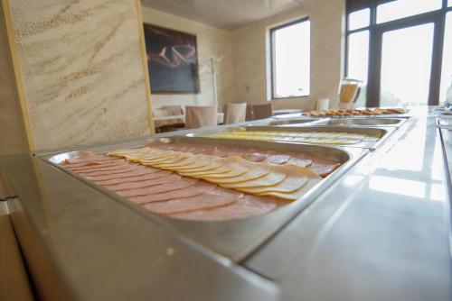 a buffet line with different types of meats and cheese at Park Hotel Arbanassi in Arbanasi