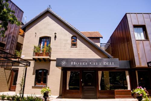 a store front of a house with a hotel city bill at Hotel City Bell in La Plata