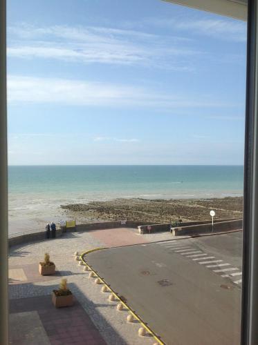 a view of the beach from a window at Blanc d'ecume in Ault