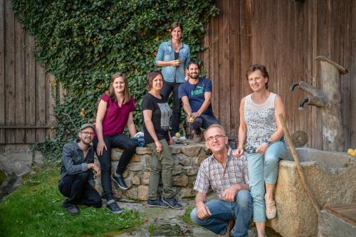 a group of people posing for a picture in front of a fence at Prinzenhof in Grossgerungs