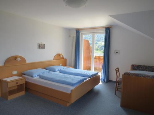 מיטה או מיטות בחדר ב-Mühlhaus