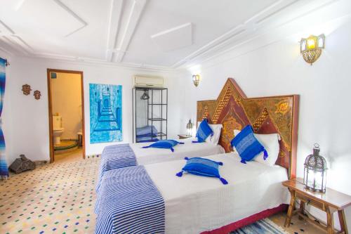 Postel nebo postele na pokoji v ubytování Riad Dar Skalli & SPA