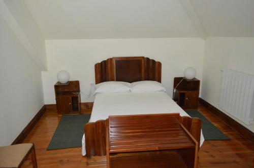 מיטה או מיטות בחדר ב-Casa Vermelha