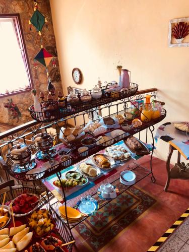 a group of shelves filled with different types of food at Pouso Realeza in Tiradentes