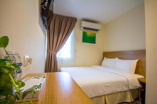 a hotel room with a bed and a window at 118 Hotel,Dato Keramat - Self Check In in George Town