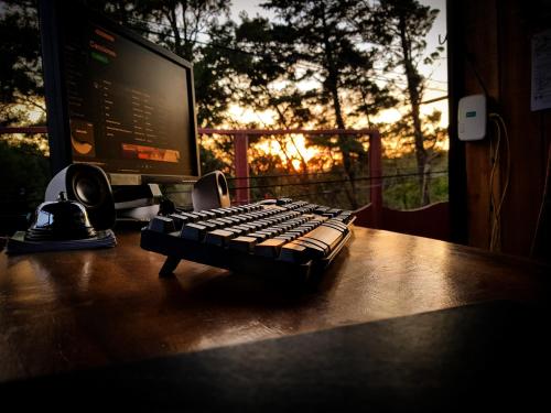 a computer keyboard sitting on top of a desk at Greemount Hotel in Monteverde Costa Rica