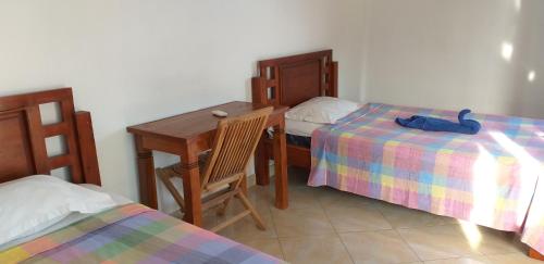 Cama o camas de una habitación en Amed Sari Beach Guesthouse