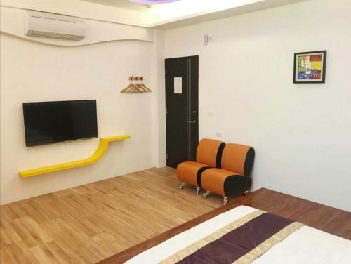 TV a/nebo společenská místnost v ubytování Purple Shell Homestay II