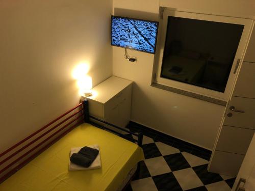 a small room with a small table and a window at Mundial Apartments in Njivice