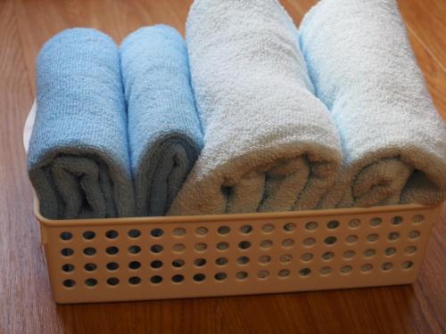 a basket filled with towels on a table at Free bike & free WIFI 203 Take it easy in Kyoto