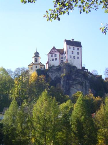 a group of houses on top of a mountain at Ferienwohnungen Porisch in Egloffstein