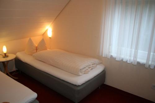 Giường trong phòng chung tại Ferienwohnungen Porisch
