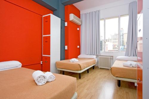 Letto o letti in una camera di Madrid Motion Hostels
