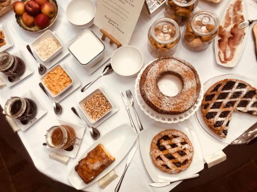 a table with pies and other food items on it at Convento di San Colombo in Santo Stefano di Sessanio