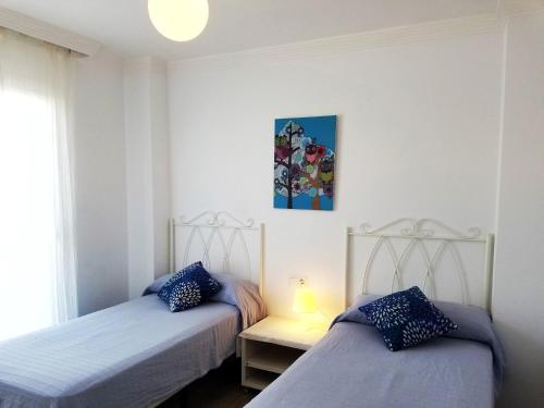 Voodi või voodid majutusasutuse Maravilloso apartamento toas