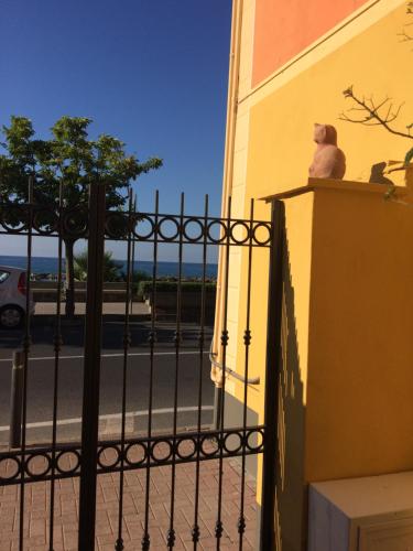 a teddy bear sitting on top of a fence at Bistrot del mare in Santo Stefano al Mare