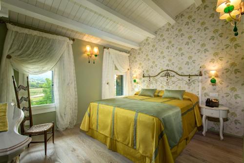 En eller flere senge i et værelse på Colonìa Resort