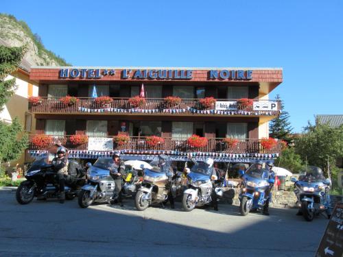 a group of motorcycles parked in front of a hotel at Aiguille Noire in Valloire