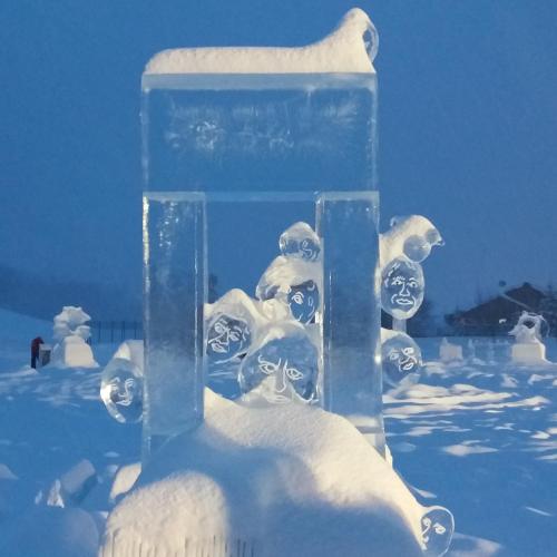 an ice sculpture of an ice cube in the snow at Aiguille Noire in Valloire