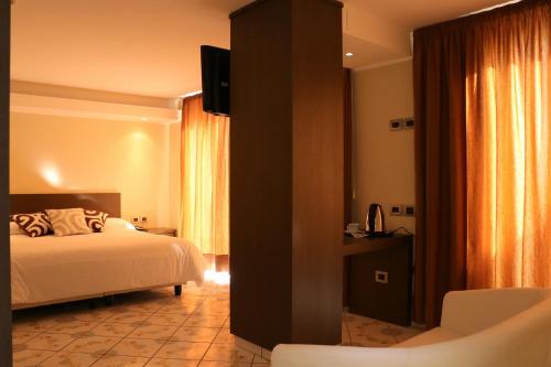 Postel nebo postele na pokoji v ubytování Hotel Ancora