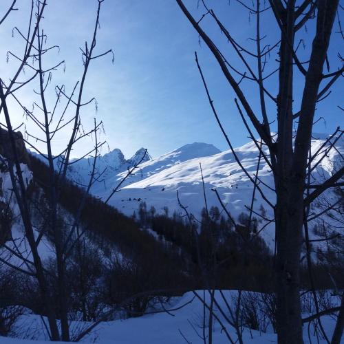 a view of a snow covered mountain in the distance at Aiguille Noire in Valloire