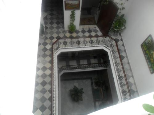 a fireplace in a room with a tiled at Hostal Centro Sol in Cádiz