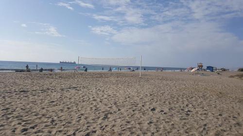 a volley ball net on a sandy beach at Apartment zona Naturista in Vera